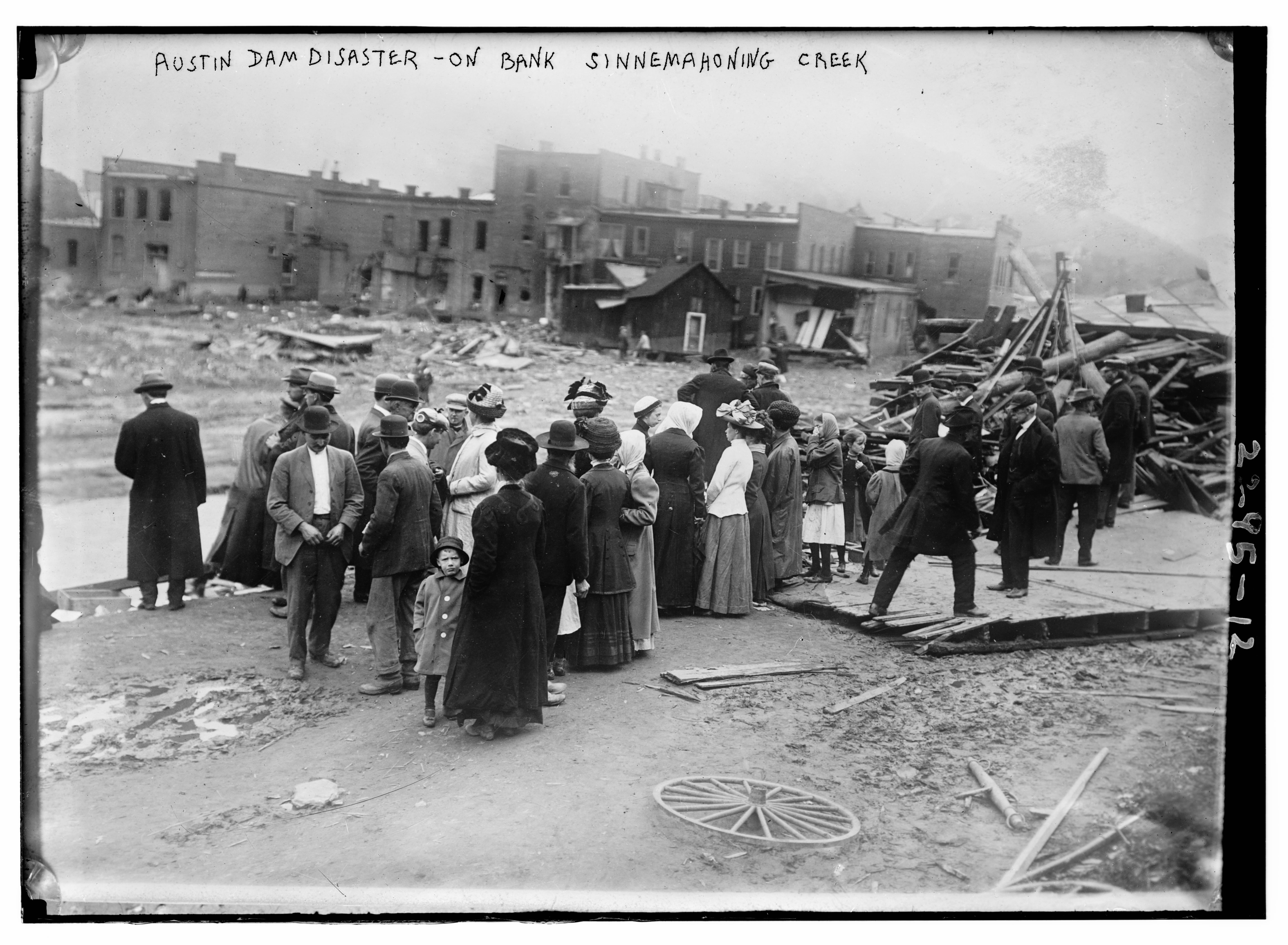 Onlookers survey damage in the aftermath of the Austin Flood