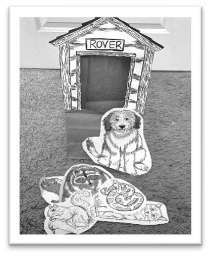 Rover dog house on paper bag with animal images cut out