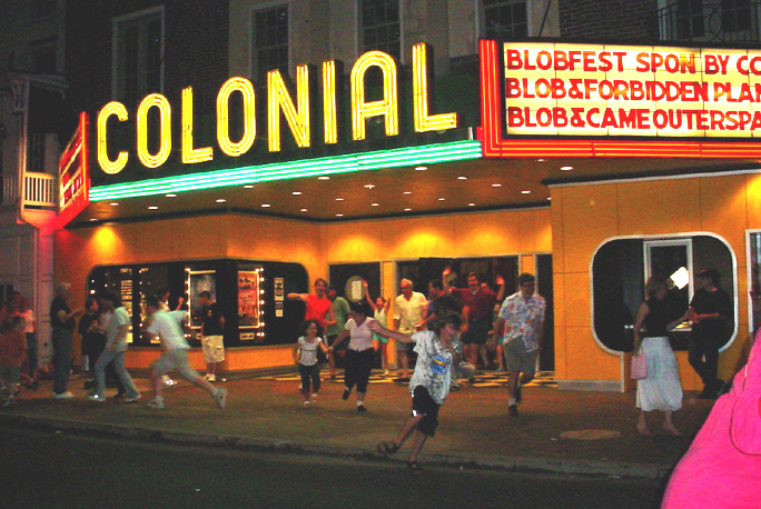 Festival Attendees run out of the Colonial Theatre, re-enacting a scene from The Blob