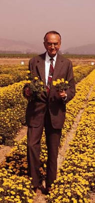 David Burpee in a field of marigolds