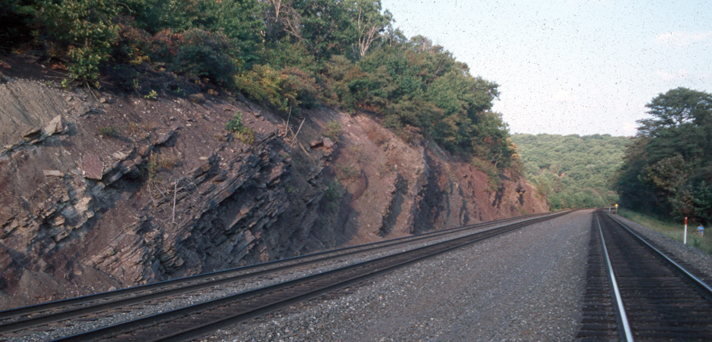 Train tracks cut through rock at the Horseshoe Curve