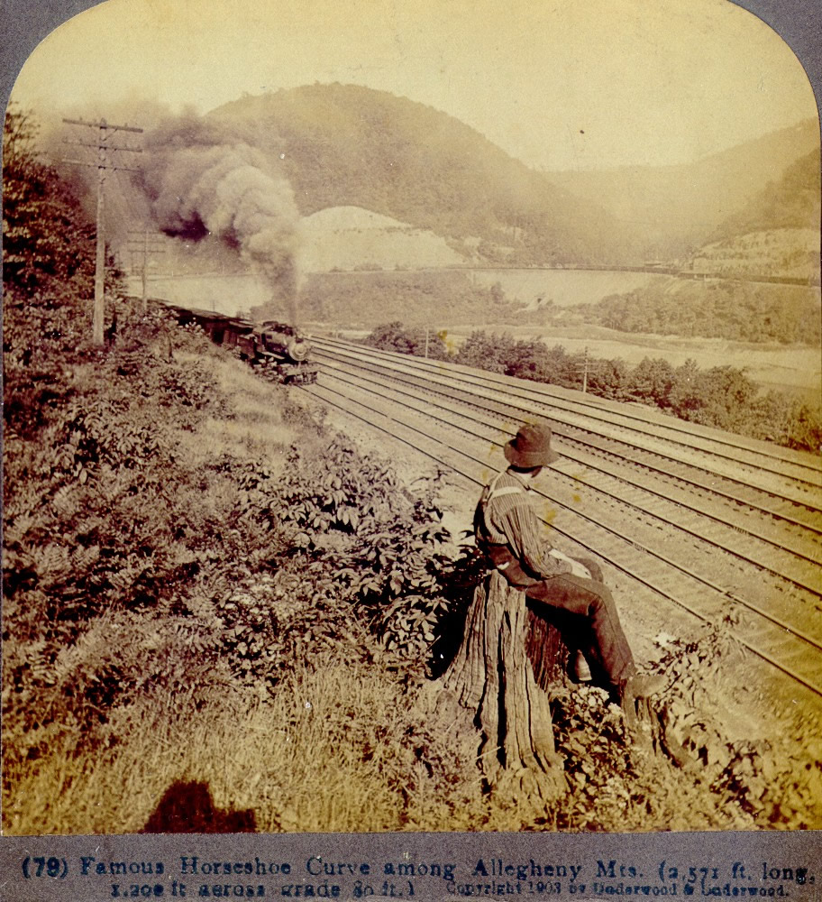 A Man Watches a Train going through the Horseshoe Curve