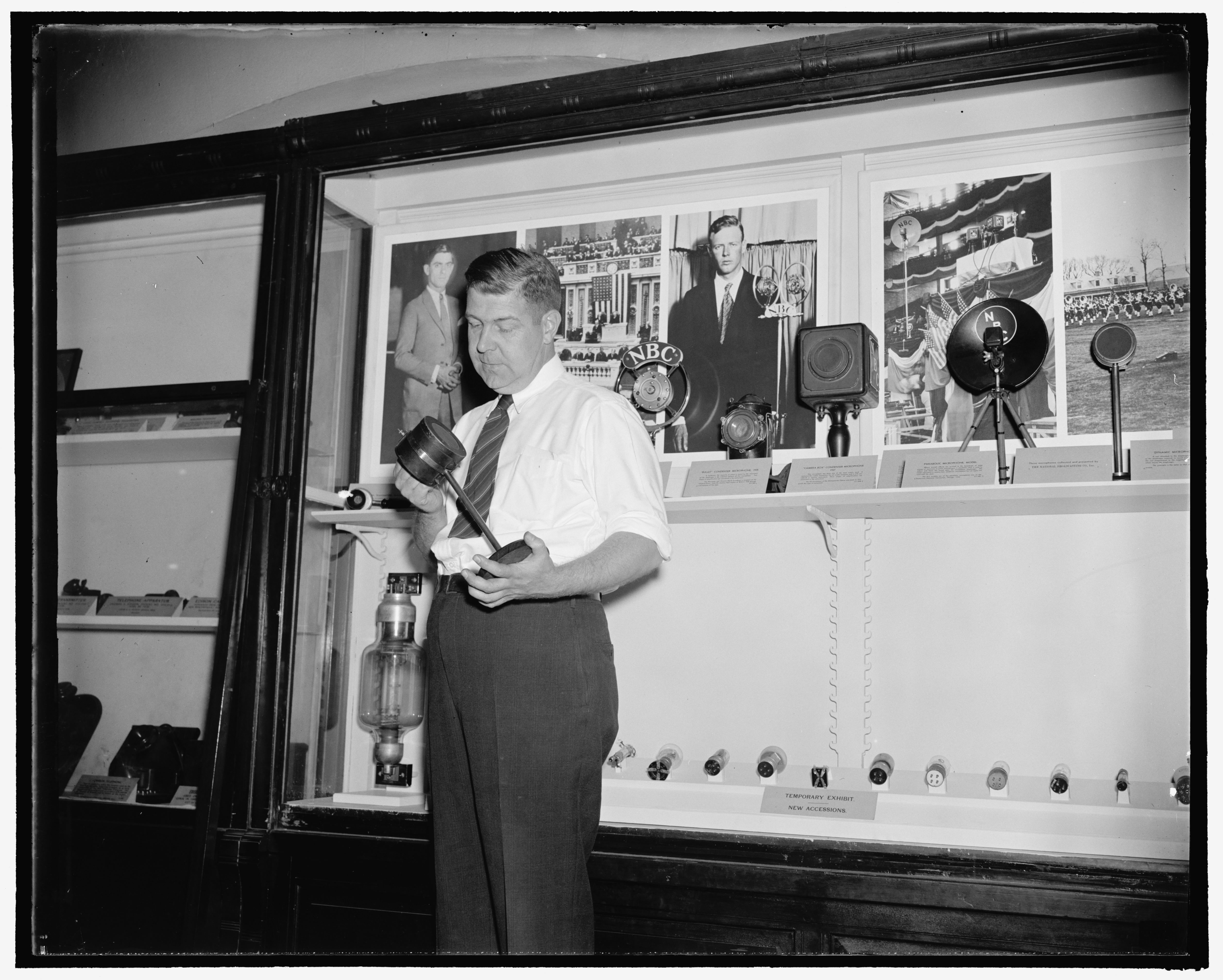 Fred C. Reed holds the tomato can microphone used to announce the returns in the 1920 Presidential election