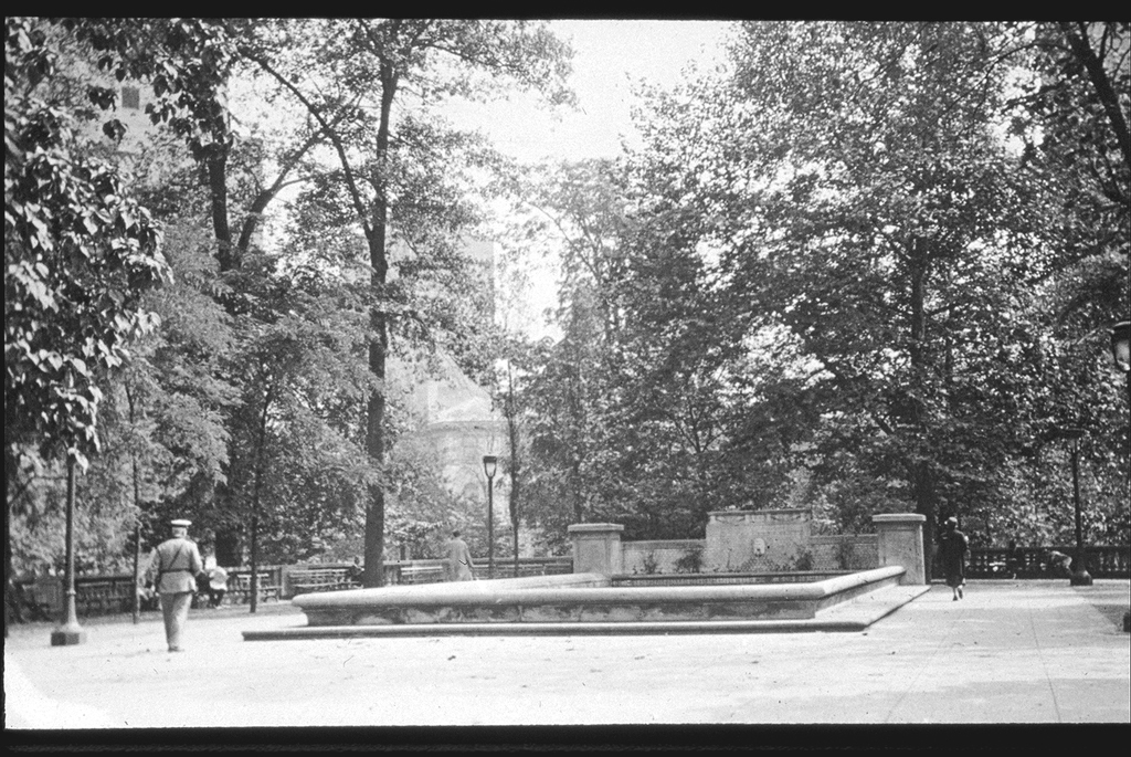 Fountain in Rittenhouse Square with officer on patrol